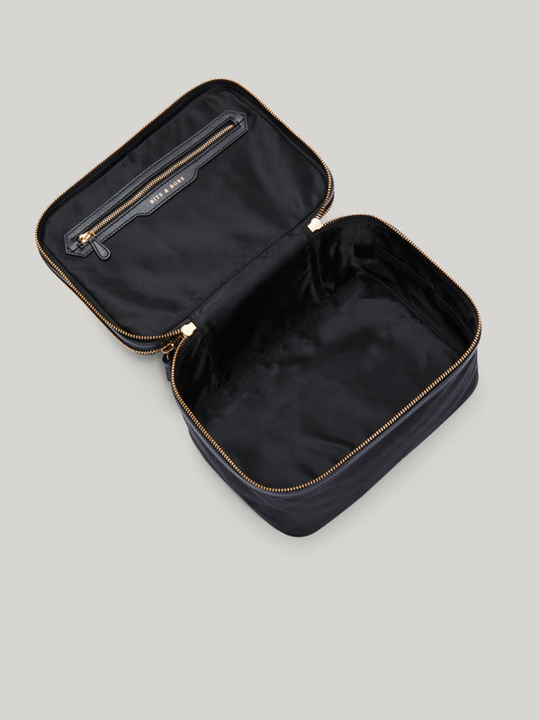 The Anya Hindmarch two-tier Vanity Kit has a spacious silhouette, split into two separate compartments: One boasts room to store 10 individual make-up brushes alongside a pocket for loose bits, and another that has plenty of space for your skincare routine.