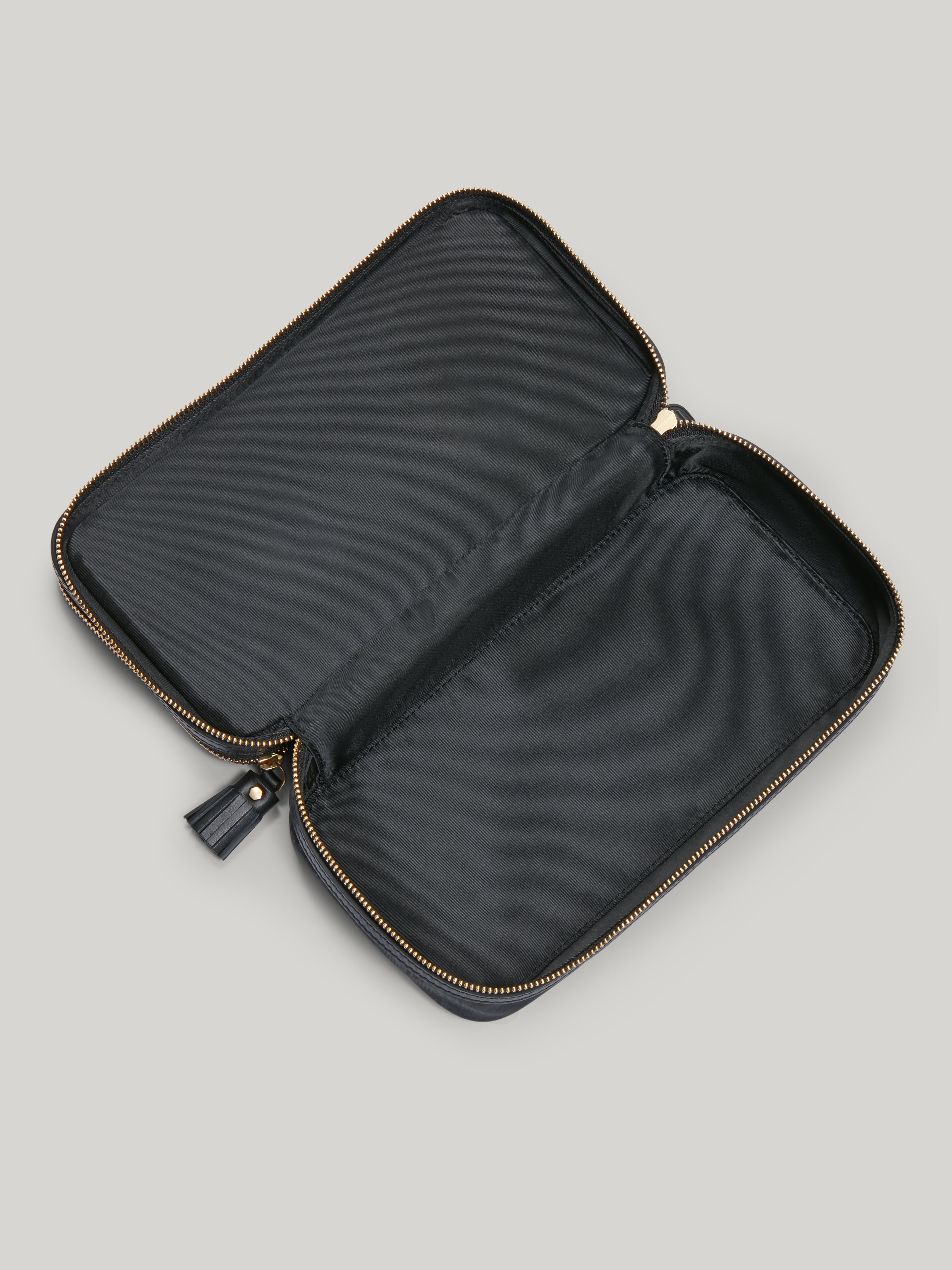 The Anya Hindmarch Makeup pouch is a must-have for both long-haul trips and weekends away. With a streamlined yet cleverly organised design, its dual zipped compartments will keep make-up brushes separate from products like eyeshadows, blusher, lipsticks, and more – ensuring everything stays clean and easy to locate.