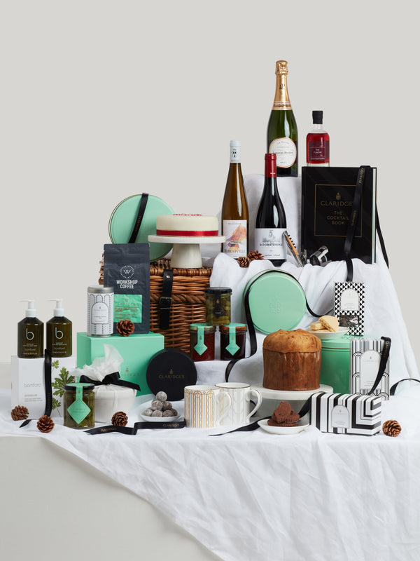 The Davies Hamper containing a generously curated collection of artisan food and homeware products. Including Claridge's Christmas Pudding, cake and Panettone. 