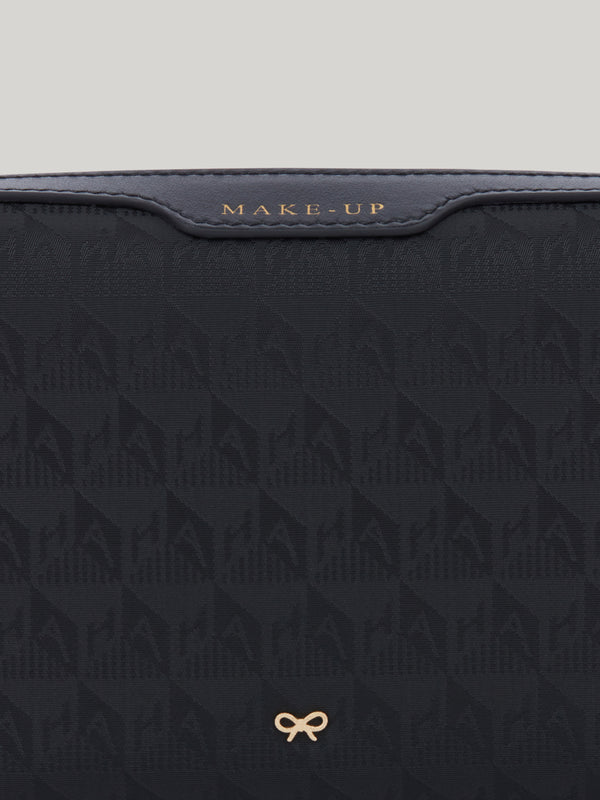 The Anya Hindmarch small make up pouch is perfect to carry your everyday essentials. Made from durable, monogrammed nylon, its spacious silhouette is split into two compartments, so you can keep your brushes safely stored and separate from your creams, blushers and bronzers in the second pocket.