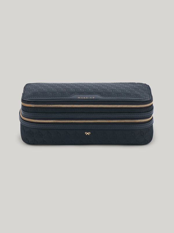 The Anya Hindmarch Makeup pouch is a must-have for both long-haul trips and weekends away. With a streamlined yet cleverly organised design, its dual zipped compartments will keep make-up brushes separate from products like eyeshadows, blusher, lipsticks, and more – ensuring everything stays clean and easy to locate. 