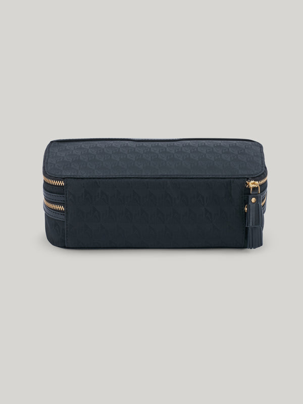 The Anya Hindmarch Makeup pouch is a must-have for both long-haul trips and weekends away. With a streamlined yet cleverly organised design, its dual zipped compartments will keep make-up brushes separate from products like eyeshadows, blusher, lipsticks, and more – ensuring everything stays clean and easy to locate. 
