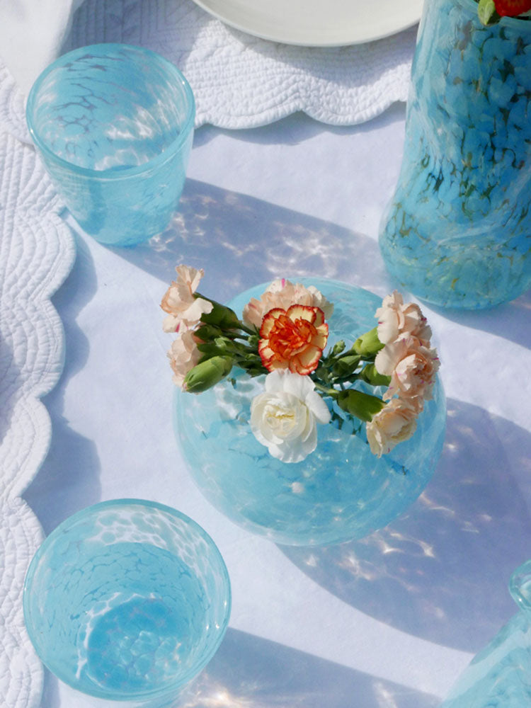 Developed in collaboration with London based glassware brand CURIO this handblown vase is the perfect centre piece to any tablescape.